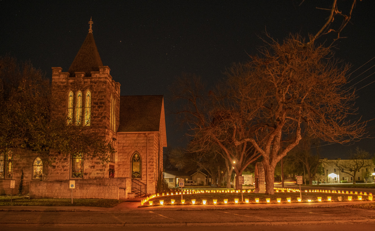 Luminaries adorn the grounds of St. John's United Methodist Church on Thursday, December 15. (Photo by Andy Sharp)