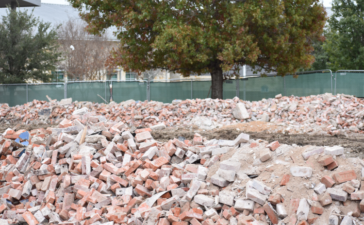 Piles of bricks are all that’s left of Jarrell ISD’s iconic 1916 Building. The district had planned to renovate, but engineers determined it was not structurally sound. The bricks will be used to construct an identical building. (Photo by Katherine Anthony)