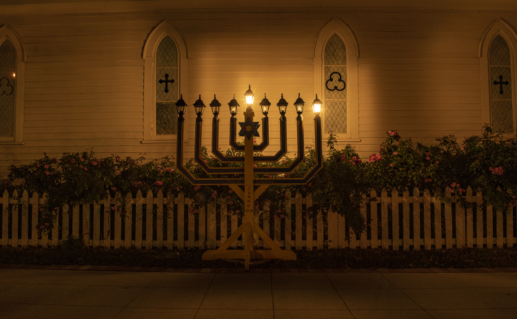 A  menorah placed near Grace Heritage Center at Ninth and Main Streets, is seen on Sunday, December 18, 2022, the first night of Hanukkah.  The menorah, placed by Georgetown's Messiah Echad, will add a light each night beginning at 6 p.m through Hanukkah.