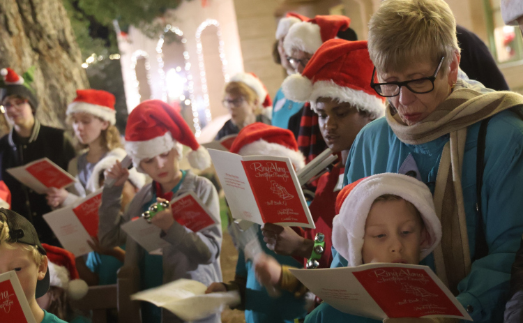 Children from the First Presbyterian Church LOGOS Program spread Christmas cheer in downtown Georgetown earlier this month. Children look forward to dressing up in Christmas attire and singing their favorite carols for visitors downtown during the annual event for the church, which sits just one block east of the square. (Photos courtesy Ron Parks Photography)