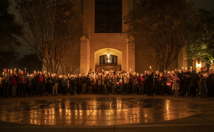Attendees gather to sing “Silent Night “outside Southwestern University’s Lois Perkins Chapel at the conclusion of a Candlelight Service of Lessons and Carols Thursday, December 1.