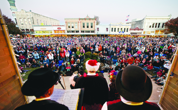 On the steps of the historic Williamson County Courthouse, the  Austin Carolers entertain the crowd gathered at the Georgetown Square for the Lighting of the Square on Friday, November 28, 2014. (Sun Archive)