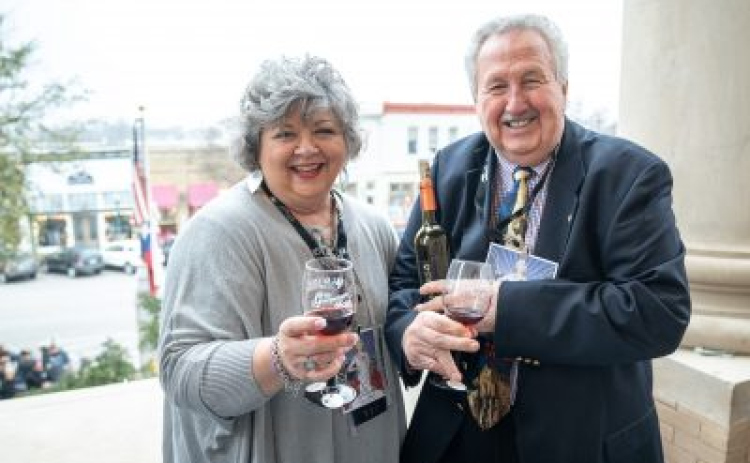 2019 Honorary Chairs Jim and Cindy Harrington hold their Georgetown Swirl glasses. (Courtesy of Williamson County)