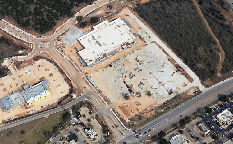 On New Year’s Day, construction takes a break on the new H-E-B on West University across from Wolf Ranch Town Center. The street-facing facade is in place and the store is expected to open later this year. On the left, work continues on Ascension Seton Health Center. The center will include outpatient specialties, surgeries and imaging services. Ascension plans to open in June. (Photos by Clark Thurmond)