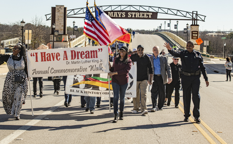 Participants march on South Mays Street during Round Rock's 36th Annual Commemorative Dr. Martin Martin Luther King, Jr. Celebration on Saturday, January 14. The march was followed by a program at the Allen R. Baca Center. (Photos by Andy Sharp)