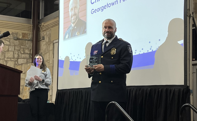 Georgetown Police Chief Cory Tchida holds a plaque after being named the chamber’s Citizen of the Year Thursday, January 26, at the annual chamber gala. (Photo by Kate St. Clair)
