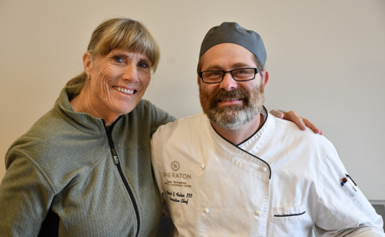 Holiday Meals Delivered organizer Beth Jenkins stands with the Sheraton in Georgetown’s Chef Robert Felios. (Photos courtesy Women Helping Others)
