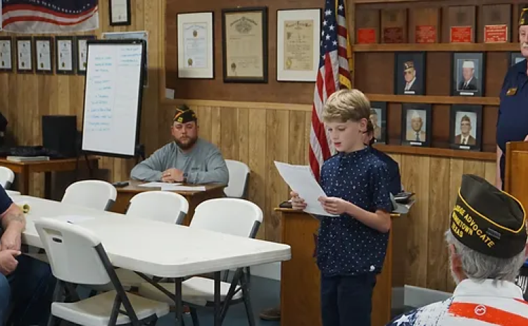Patriot’s Pen winner Adrik Stepanov reads his winning essay to VFW Post 8587 members at the group’s monthly meeting. Adrik is 11 and attends Meridian World School as a sixth grader. His parents are Rachel and Yegivny (Will) Stepanov.