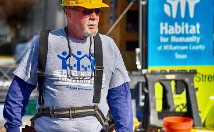Ed Harmes on the job volunteering at Habitat for Humanity.