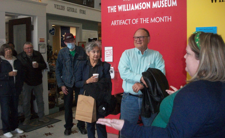 Danelle Houck (right foreground), educator for the Williamson Museum, leads a Camille’s Memory Café tour group March 17. Participants learned about District Attorney Dan Moody and his successful 1923-24 prosecution of four Ku Klux Klan members. Photo by Brad Stutzman