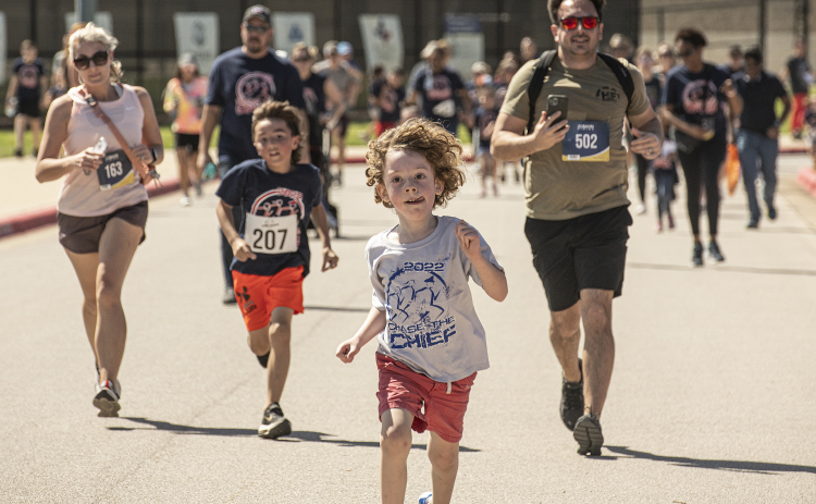 4-year-old Leo Ormeni makes a dash for the finish line while participating in the Fun Run during  Chase the Chief , held at  East View High School on Sunday, March 5. The 11th Chase the Chief included a Fun Run and a 5-K Race.   Proceeds from the annual event benefit physical education and athletic departments in Georgetown ISD.    Photo by Andy Sharp.