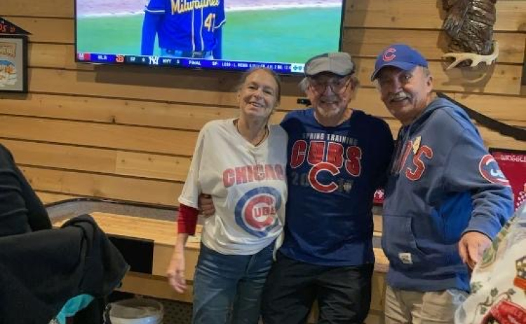 Cubs fans Sue Bryson, Bill Hougesen and Jim Bonk watch a game in Sun City on opening day. Photo by Linda Dwyer