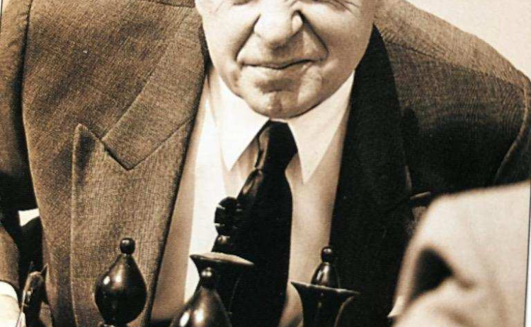 As an older man, Howard Bleeke played cranky old men and elegant old men. In this photo, he is shown as a participant in a chess game.