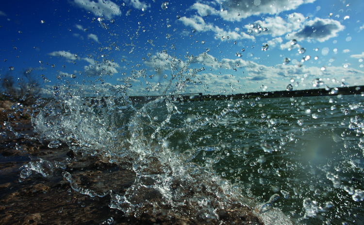 Lake Georgetown is shown as waves of water pound the shoreline.