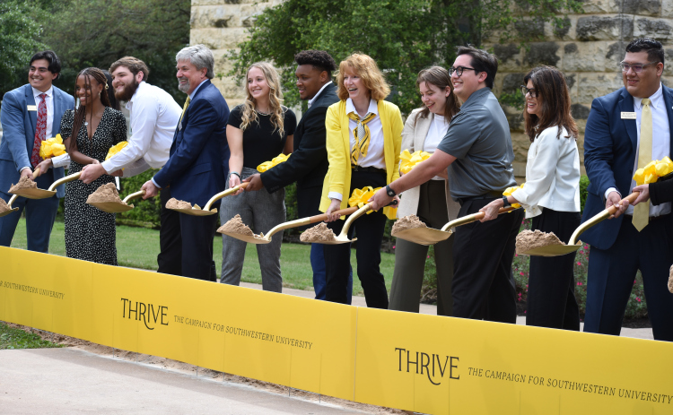 In a ceremonial groundbreaking April 14, President Laura Skandera Trombley (center), Trustee chair Christopher Cragg (fourth from left), Trustee Lynn Mock (second from right), and students kick off the university’s $150 million building project.