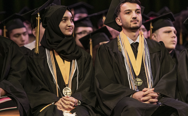 Class Salutatorian Marwa Azizi, left, and her brother, class Valedictorian Walid Azizi, are shown at the Commencement ceremony for Richarte High School, held at the Klett Performing Art Center on Thursday, May 25. The school's top graduates came here from Afghanistan with their family in 2022.