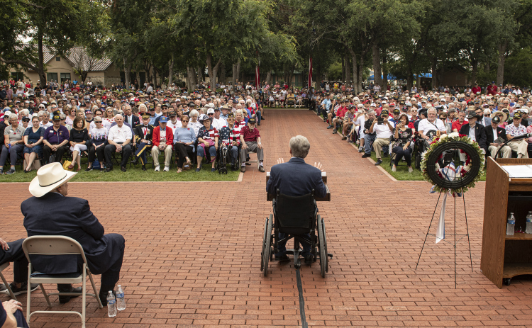 Texas Governor Greg Abbott speaks to a large crowd gathered at the Sun City Texas Community Association Memorial Day observance held Monday, May 29.