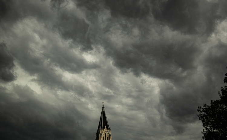 The spire at Georgetown's First United Methodist Church rests under layers of clouds on Friday evening, April 28, 2023.  Rain, accompanied by hail and high winds in some areas, moved through Williamson County throughout the evening.