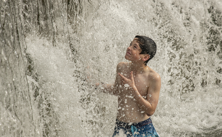 Jon Martinez, who was accompanied by his twin brother Jake and their parents, had fun beating the June heat at Blue Hole Park