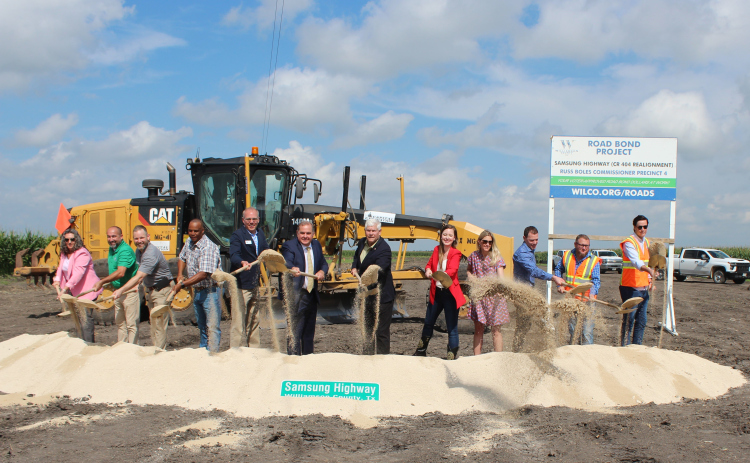 Standing, from left, are Rhonda Redden, justice of the peace Precinct 4; Robert Garcia, Taylor City Council; Brian LaBorde Taylor City Manager; Taylor Mayor Pro-Tem Gerald Anderson; Taylor Mayor Brandt Rydell; Wilco Precinct 4 Commissioner Russ Boles; Congressman Pete Session; Representative Caroline Harris; Dana Harris and Matt Menotti, with Samsung; and Levi Pickett and Andy Wynes, with Capital Excavation. Photo courtesy Williamson County