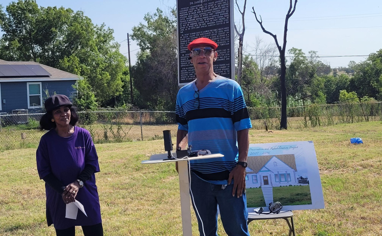 Dickey Museum and Multi-purpose Center President Jennifer Harris (left) introduces Bruce Dickey, Dr. Dickey’s grandson, to give a speech at the press conference Monday June 10. Photo by Nalani Nuylan.