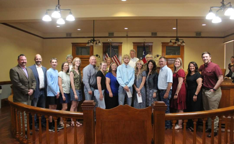 Williamson County Fair and Rodeo pose with the 2023 scholarship recipients and their families. The recipients are Ty Chase (center blue shirt), Paige Phalen (center blue dress) and Madeline Edwards (left in green and black shirt). Photo courtesy Williamson County Fair and Rodeo.