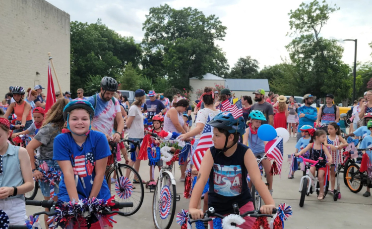 Families gather on their bikes ahead of the Old Town parade on July 4. Photo courtesy Amanda Parr
