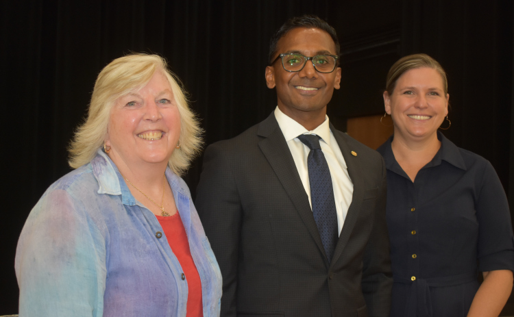GISD trustees, president Elizabeth McFarland, right, and board secretary Stephanie Blanck, left, congratulate Devin Padavil following the board’s vote officially naming him the district’s next superintendent.
