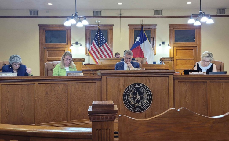 The Williamson County Commissioners Court discusses an item on the August 22 agenda. Photo by Nalani Nuylan.