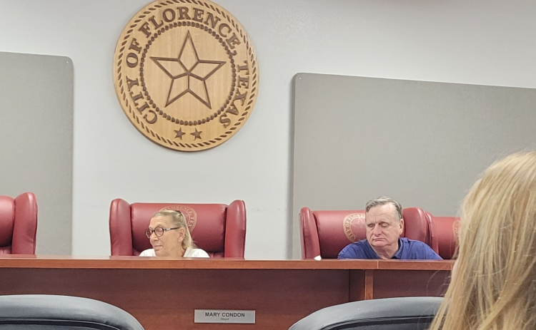 Florence City Mayor Mary Condon (left) listens to a resident’s comments during the August 1 City Council meeting. Photo by Nalani Nuylan.