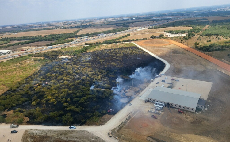 A grass fire named Rock Quarry consumes 21 acres of land near Jarrell on Friday, September 1. More than 20 organizations helped fight the fire. Photo courtesy of Williamson County.