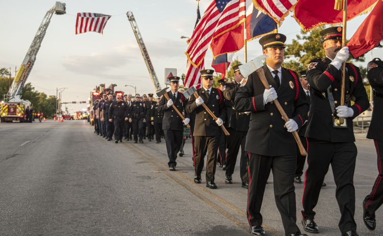 Parade participants march along Main Street during Taylor's Patriot Day observance on Monday, September 11, 2023.