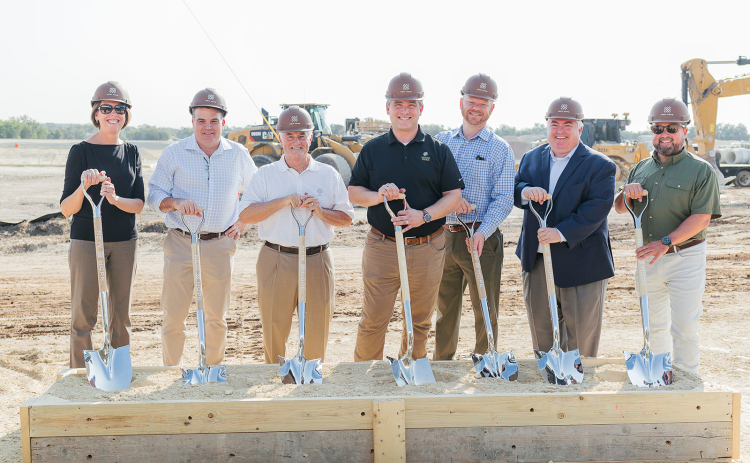 Mayor Jim Penniman-Morin of Cedar Park (middle) with representatives from  Cordova Real Estate Ventures, Riverside and Live Oak breaks ground on a 95-acre project called New Hope Corporate Park in Cedar Park August 31. Photo courtesy of Meredith Bender.