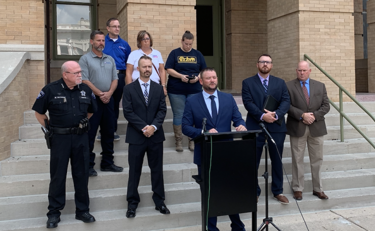 Charles Duval, third from left, the president of the Williamson County Deputies Association was joined by supporters as he spoke to the press on August 29. (Photo by Kaitlyn Wilkes)