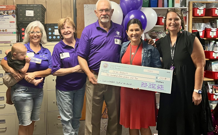 From left to right, Florence Education Foundation board members Kim Daniel, Peggy Morse, Dr. Woody Ray, and Angela Gower (end) present a $250 check to Florence Elementary School teacher Sarah Stephens (middle).  Photo courtesy of Peggy Morse.