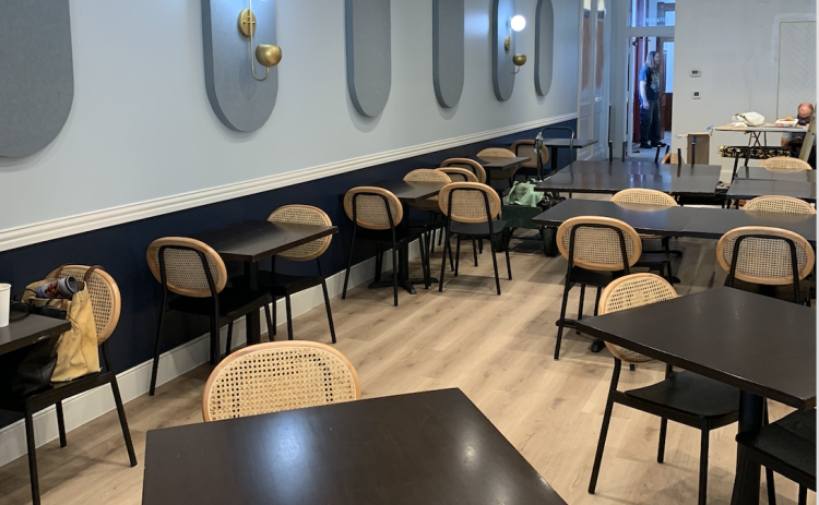 The first floor of the building features two top and four top tables for guests. (Photo by Kaitlyn Wilkes)