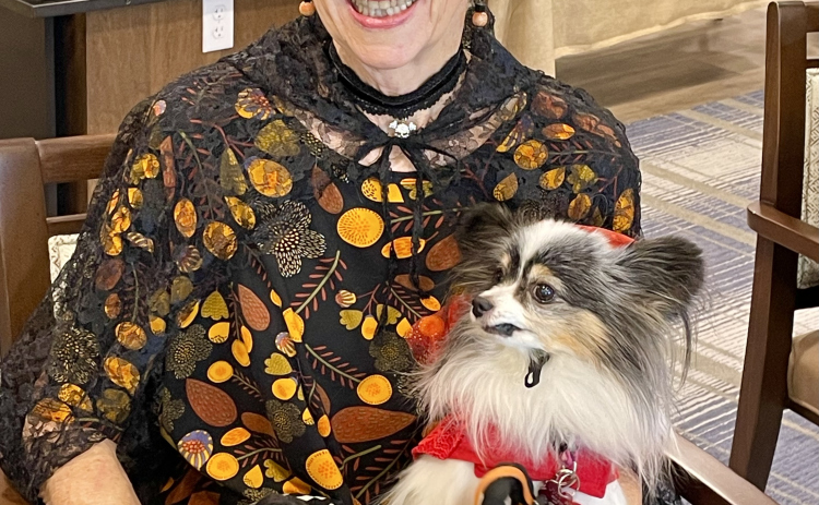 Hacienda member Judy Mayo dresses in the fall spirit with her dogs Tsunami and Misty.
