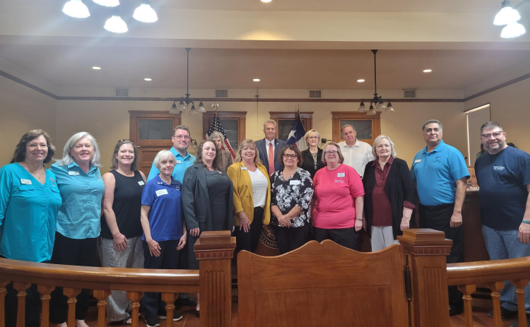 Williamson County Commissioners and representatives from food pantries across the county pose for a photo during the November 7 Commissioners Court at the county courthouse. Photo by Nalani Nuylan.
