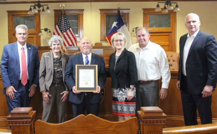 Salvador Lopez, center, was recognized for his 40 years of service in Juvenile Services at the November 7 Commissioners meeting at the county courthouse. Photo courtesy of Williamson County.