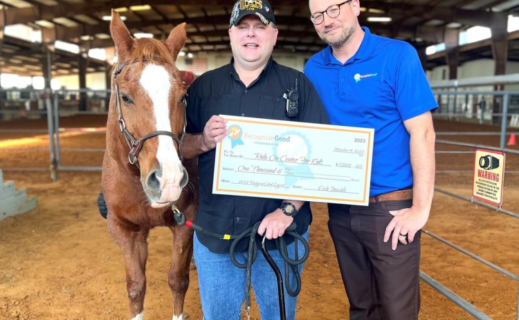 Erik Stoeckle, center, is one of seven recipients of the 2023 RecognizeGood Legend Award. As of writing, he has 18,000 volunteer hours with ROCK. Photo courtesy of Ride On Center for Kids.