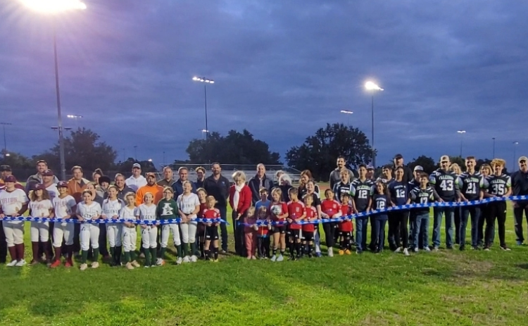 Williamson County Commissioner Precinct 3 Valerie Covey cuts a ribbon to celebrate the Southwest Williamson County Regional Park lighting project. Photo by Nalani Nuylan.