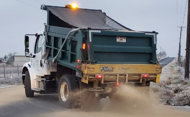 Williamson County Road and Bridge crews spread 250 gallons of chemical de-icer and 15 tons of sand on county roads, bridges and overpasses on Sunday night in preparation of the winter weather. Photo courtesy of Williamson County Emergency Management.