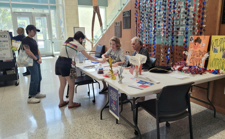 League of Women Voter volunteers help residents register to vote for their first election at the Georgetown library on September 19, 2023. Photo by Nalani Nuylan.