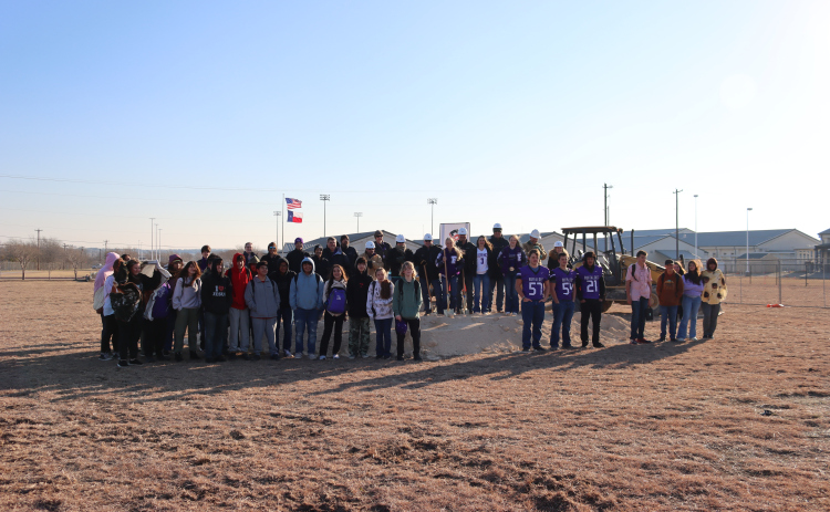 Members from the Florence Independent School District, Leander-based construction company Braun and Butler and students from the band and athletic programs at Florence High School pose in before breaking ground on the future site of the Band Hall and field house last Friday. Photo courtesy of Florence ISD.