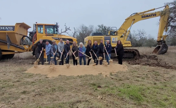 Williamson County Commissioner Cynthia Long, along with Liberty Hill City Council members, LJA representatives and Chasco contractors, break ground on the Liberty Hill Bypass. Photo by Nalani Nuylan.