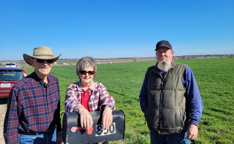 Betty Liese and her family pose in front of their family farm in Weir. There are plans for an Atmos Energy pipeline to run through the middle of the property, which has been in her husband’s family for 100 years. Photo by Nalani Nuylan.