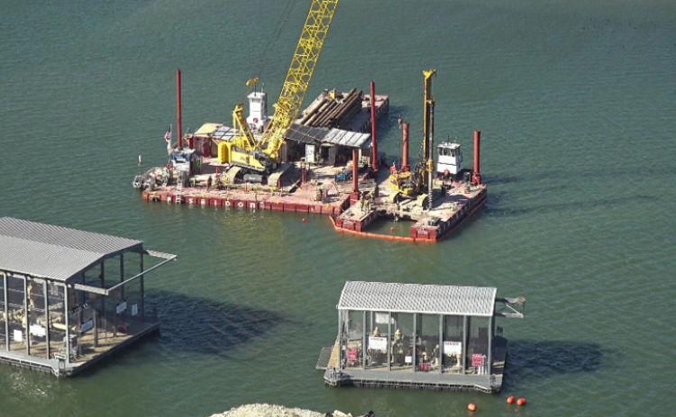 A construction barge floats on Lake Travis ready to replace a pipeline for the Brushy Creek Regional Utility Authority. Photo courtesy of the City of Leander.