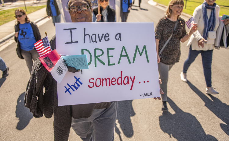 Latosha Davis was among those marching from the Georgetown square during the Dr. Martin Luther King, Jr. march and program held on Monday, February 19th, 2024.  The event was planned for the Dr. Martin Luther King, Jr. national holiday, but weather postponed it until today, Presidents Day.   The march was followed by the program held at Macedonia Baptist Church, at 206 Martin Luther King, Jr. Street.