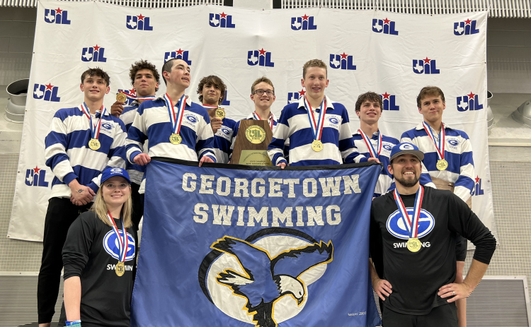 Georgetown High School coaches Reghan Hartsell and Jeremy Kline stand with the 5A champions.