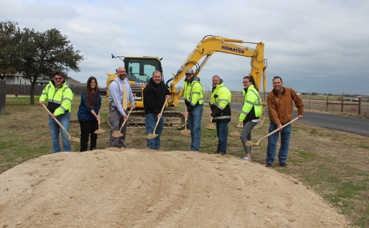 From left to right Scott Ambrus (Chasco), Jarrell Council Member Tanya Clawson, Whit Friend (HNTB), Pct. 4 Commissioner Russ Boles, Joseph Jones (HNTB), Joe Cobuccio (Chasco), Lauren Sharpe (Chasco), Oscar Salazar-Bueno (HNTB) break ground on County Road 332 expansion. Photo courtesy of Williamson County.